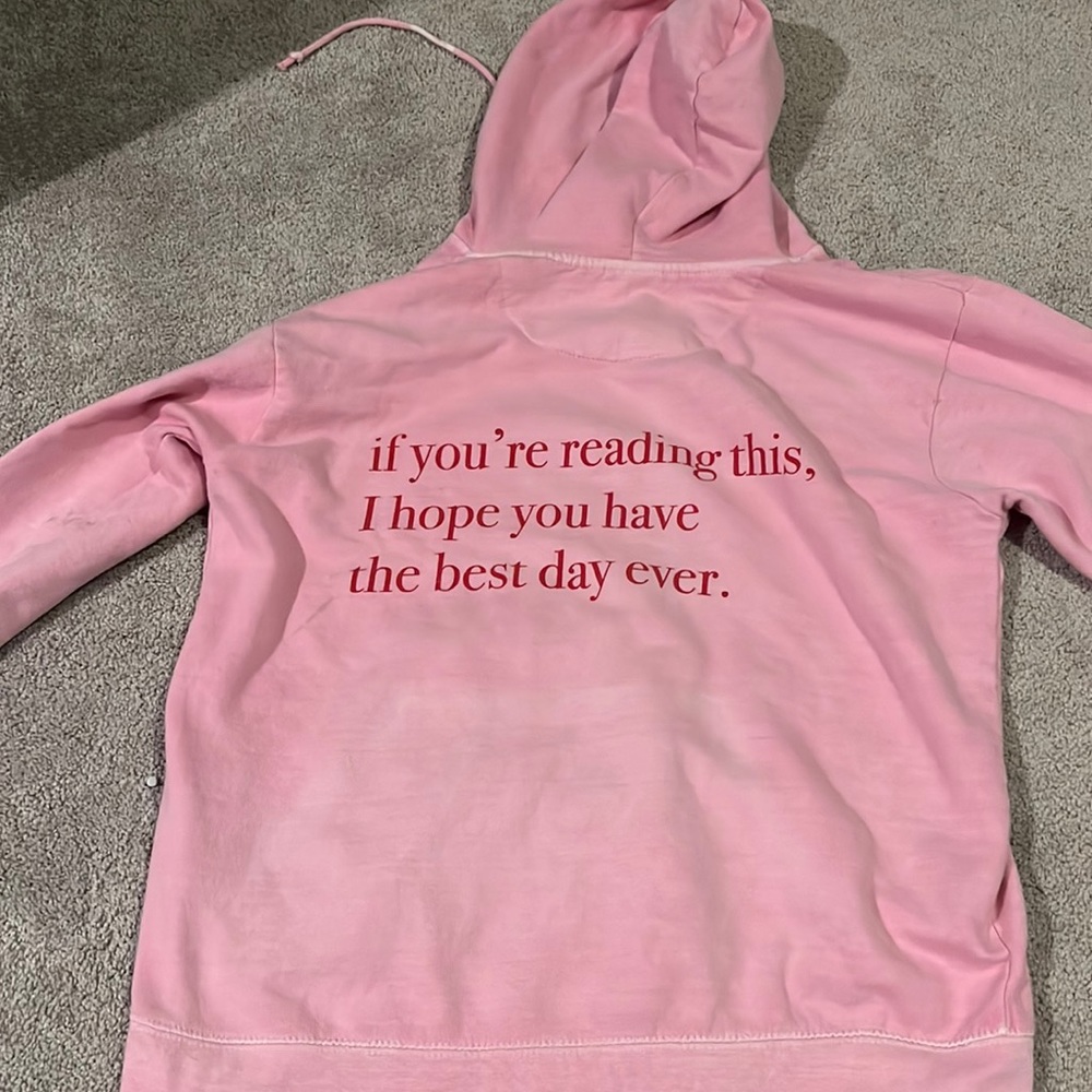 pink sweatshirt with words on the back. from etsy. size small